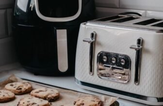 Air fryer on a kitchen countertop preparing crispy food