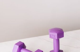 Purple dumbbells on a marble surface