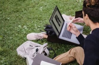 Student using a laptop while studying on campus