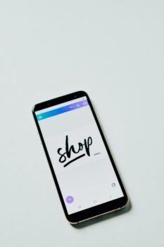 Phone showing an online booking site, representing how to spot a fake travel deal