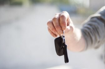 Car rental key handover representing rental car deals